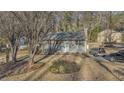 House with a gray roof, yard, and driveway, seen from above at 6460 Boca Grande Blvd, Forest Park, GA 30297