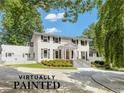 Virtually painted white two-story house with landscaping and a long driveway at 1195 Old Woodbine Rd, Atlanta, GA 30319