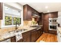 Spacious kitchen with granite countertops, stainless steel appliances, and hardwood floors at 1195 Old Woodbine Rd, Atlanta, GA 30319