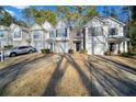 Front view of townhouses with driveway parking at 3654 Woodland Cv, Decatur, GA 30034