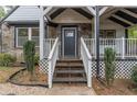Inviting front entrance with stone detailing and a covered porch at 2711 Glenwood Se Ave, Atlanta, GA 30317