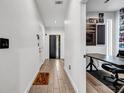 Bright and airy entryway with wood-look flooring and modern door at 597 Hope Sw St, Atlanta, GA 30310