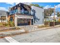 Contemporary home with a glass balcony and attached garage at 597 Hope Sw St, Atlanta, GA 30310