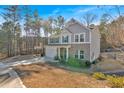 Two-story house with gray siding, brick accents, and a basketball goal at 3501 Great Sky Pkwy, Canton, GA 30114