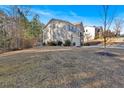 House's side yard with basketball goal and grassy area at 3501 Great Sky Pkwy, Canton, GA 30114