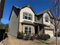 Side view of a two-story house with brick and siding, showcasing the home's architectural details at 1284 Brynhill Ct, Buford, GA 30518