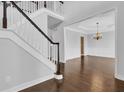 Two-story entryway with hardwood floors and a view of the dining room at 1325 Cameron Glen Dr, Marietta, GA 30062