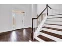 Elegant staircase with dark wood steps and white railing at 1325 Cameron Glen Dr, Marietta, GA 30062