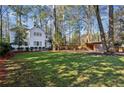 Spacious backyard with detached shed and large grassy area at 2460 Oldfield Rd, Atlanta, GA 30327