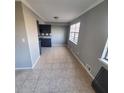 Spacious dining area with tile flooring and neutral walls at 6354 Shannon Pkwy # 6C, Union City, GA 30291