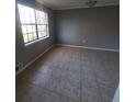 Bright dining room featuring tile flooring and large window at 6354 Shannon Pkwy # 6C, Union City, GA 30291