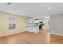 Bright, open-concept kitchen with stainless steel appliances and an island with granite countertops at 2409 Swallow Se Cir, Atlanta, GA 30315