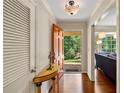 Bright foyer featuring sleek hardwood floors and views of the outdoor scenery at 6550 Bridgewood Valley Rd, Atlanta, GA 30328