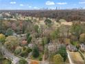 Wide shot of the house and surrounding area, showcasing the neighborhood and golf course at 1080 Clifton Ne Rd, Atlanta, GA 30307