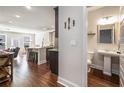 Spacious open concept layout with a kitchen island, living area, and half bathroom at 366 Cherryhill Ln, Woodstock, GA 30188