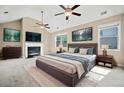 Spacious main bedroom with vaulted ceilings, fireplace, television, and large windows at 231 Haney Rd, Woodstock, GA 30188
