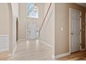 Bright entryway with hardwood floors and a grand staircase at 780 Treadstone Ct, Suwanee, GA 30024