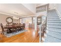 Spacious dining room with hardwood floors and large table at 550 Bircham Way, Roswell, GA 30075