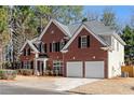 Two-story home with a large backyard and double garage at 115 Parkside Close, Alpharetta, GA 30022