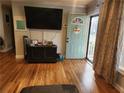 Cozy living room with hardwood floors and a stylish front door at 118 Lucia Se Dr, Smyrna, GA 30082
