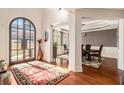 Bright and spacious entryway with a large rug and view to the dining room at 715 Jewel Sw Ct, Atlanta, GA 30331