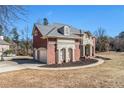 Brick house with a two car garage and manicured lawn at 715 Jewel Sw Ct, Atlanta, GA 30331