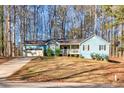 Blue house with a two car garage and large yard at 215 Silver Creek Ln, Stockbridge, GA 30281
