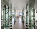 Mirrored hallway leading into a spacious and well-lit living area with great views at 2660 Peachtree Nw Rd # 25H, Atlanta, GA 30305