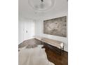 Hallway features hardwood floors, decorative ceilings, and stylish decor at 2660 Peachtree Nw Rd # 25H, Atlanta, GA 30305
