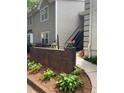 Charming exterior of the home showcasing a well-maintained brick wall and manicured landscaping at 64 Devon Ln, Avondale Estates, GA 30002