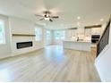 Bright living room with fireplace, hardwood floors and lots of natural light at 722 Crossroad Ct, Powder Springs, GA 30127