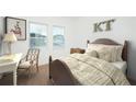 Cozy bedroom with a wooden bed frame and a built-in desk area at 7410 Cranleigh St, Covington, GA 30014