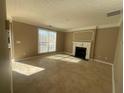 Bright living room with tile floors and fireplace at 3116 Leyland Ct, Decatur, GA 30034