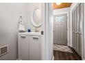 Small half bathroom with modern vanity and mirror at 326 Scarlett Ln, Woodstock, GA 30188