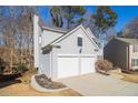 Two-story house with gray siding, white trim, and a two-car garage at 11145 Glenbarr Dr, Johns Creek, GA 30097