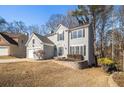 Two-story house with gray siding, white trim, and a two-car garage at 11145 Glenbarr Dr, Johns Creek, GA 30097