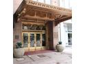 Building entrance with bronze canopy and doors at 32 Peachtree Nw St # 1601, Atlanta, GA 30303