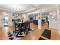 Open concept dining area with hardwood floors and a view to living room at 4901 Planters Walk, Douglasville, GA 30135