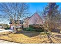 House with attached garage and mature trees in front at 4901 Planters Walk, Douglasville, GA 30135