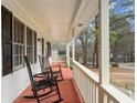 Inviting front porch with classic rocking chairs, perfect for relaxing and enjoying the outdoors at 1867 Falcon Wood Ne Dr, Marietta, GA 30066