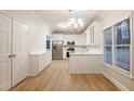 Modern kitchen with white cabinets and stainless steel appliances at 1650 Willow Way, Woodstock, GA 30188