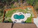 Home with a kidney-shaped pool and fenced backyard at 1907 Old Loganville Rd, Loganville, GA 30052