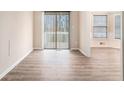 Inviting dining area with wood floors and sliding glass door access to the outside at 4196 Jami Ln, Snellville, GA 30039