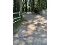 Gravel driveway providing access to the property at 4654 Hope Springs Rd, Stone Mountain, GA 30083
