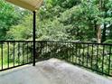 Private balcony overlooking a wooded area, providing a peaceful outdoor space at 798 Windchase Ln, Stone Mountain, GA 30083
