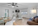 Bright living room with hardwood floors and ample seating at 300 Peachtree St # 24-I, Atlanta, GA 30305