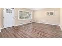 Bright living room featuring new floors, neutral walls, and multiple windows at 2318 Ousley Ct, Decatur, GA 30032