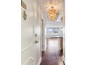 Inviting condo entryway with attractive light fixture and hardwood floors leads to a bright living space at 2479 Peachtree Ne Rd # 1012, Atlanta, GA 30305
