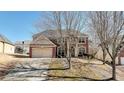 Two-story house with a two-car garage and mature trees at 3120 Esplanade Sw Cir, Atlanta, GA 30311
