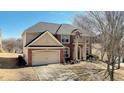 Two-story house with a two-car garage and large yard at 3120 Esplanade Sw Cir, Atlanta, GA 30311